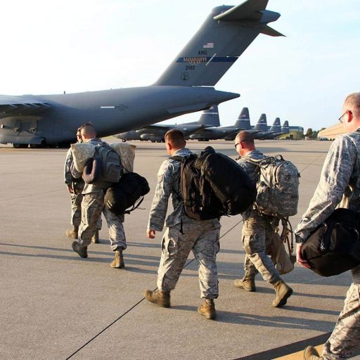 Deploying soldiers walking to plane